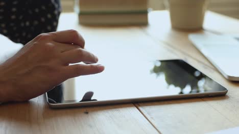 Woman-student-using-digital-tablet-on-table,-online-study-concept