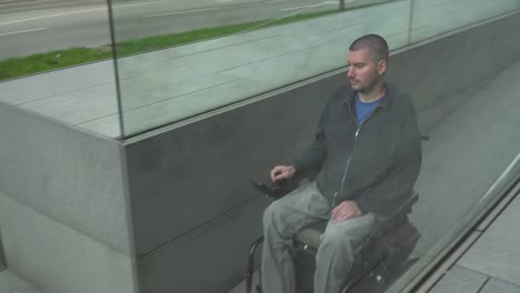 4k-resolution-follow-of-a-man-on-electric-wheelchair-using-a-ramp.-Accessibility-concept