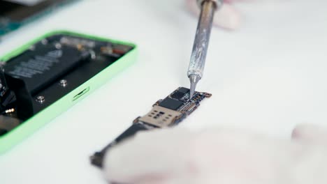 Close-up-of-mobile-phone-parts-brazing.-Services-on-repair-of-phones