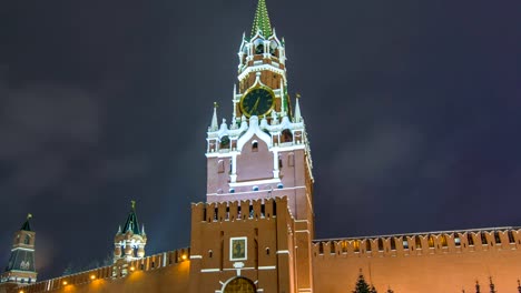 View-of-The-Saviour-Spasskaya-Tower-timelapse-hyperlapse-and-Kremlin-walls-of-Moscow-Kremlin,-Russia-at-night-in-winter