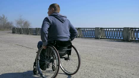 Tired-man-disability,-Wheelchair-wheels,-Difficulty-traveling-wheel-chair-on-street,-Disabled-man-in-wheelchair,-movement-people