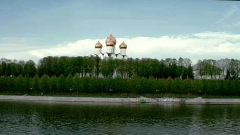 Traditional-Russian-Church-on-the-river-shore-in-spring-in-a-daytime