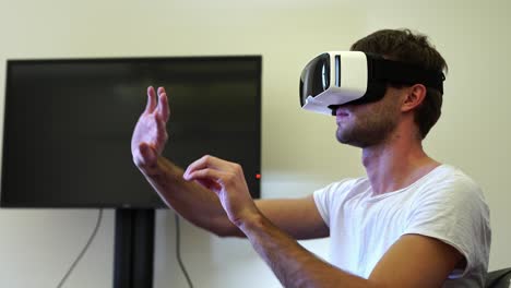 Man-Using-Vr-Glasses-Headset-Trying-To-Touch-Objects-In-Virtual-Reality.