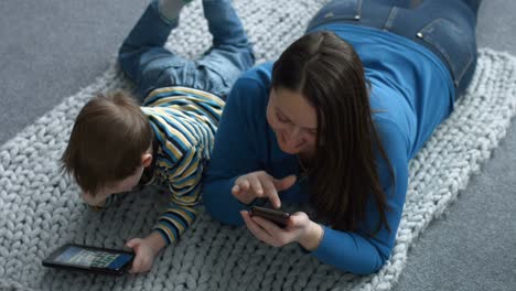 Mother-and-son-networking-with-digital-devices