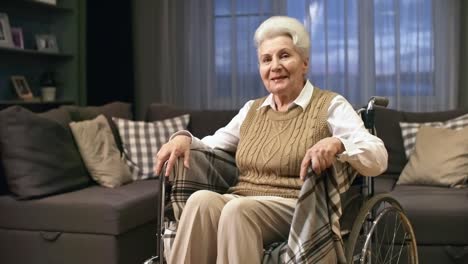 Elderly-Woman-in-Wheelchair-Waving-Hello