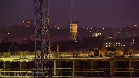 Builders-work-on-construction-site-at-night