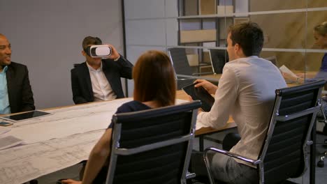 Employee-and-his-colleagues-working-with-VR-Future-technology-concept-and-drawing