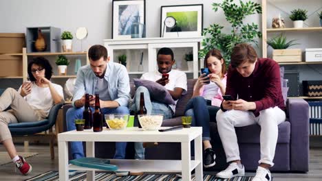 Millennials-using-smartphones-at-home-enjoying-social-media-surfing-the-internet