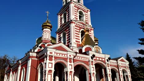 Upward-view-of-the-high-domed-Christian-church-in-motion-on-a-sunny-day.