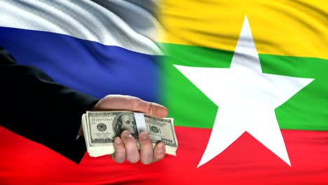 Rusia-y-Myanmar-funcionarios-intercambiando-tanque-por-dinero,-fondo-de-bandera,-ejército