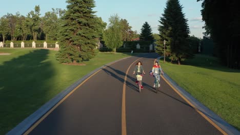 Aerial-view-of-two-lesbians-riding-bikes-in-park