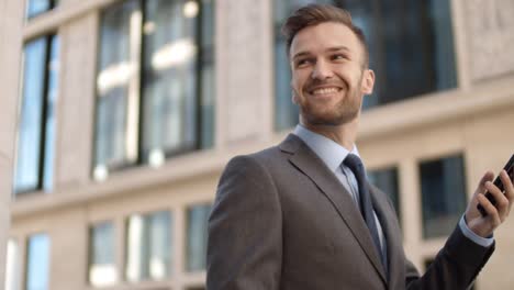 Caucasian-Businessman-Using-His-Smartphone