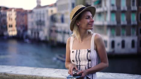 Attractive-female-traveller-searching-information-about-showplaces-in-Venice