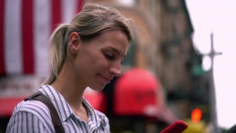 Slow-motion-effect-of-attractive-woman-tourist-checking-information-at-website-with-American-online-guide-during-time-for-exploring-city