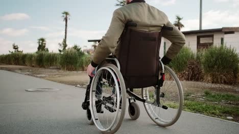 Outside-walk-of-man-in-wheelchair