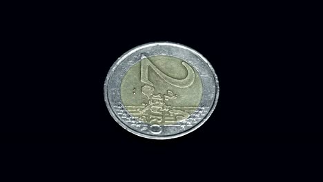 EU-coin-two-euros-rotates-on-a-black-background.-Macro.-Closeup