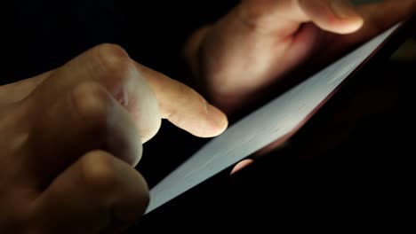 Close-up-of-hands-holding-a-tablet.-Working-with-business-charts.