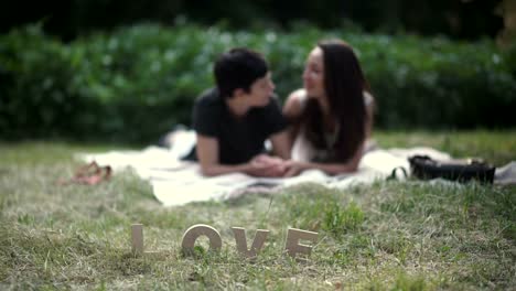 Cute-in-love-lesbians-are-relaxing-on-grass