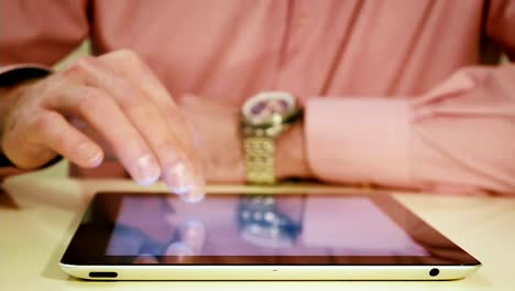 Close-Up-of-Male-Hand-Using-a-Tablet-tablet-computer-at-Home