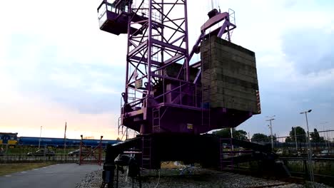 Construction-crane-rising-into-sky,-freight-transportation-equipment,-machine