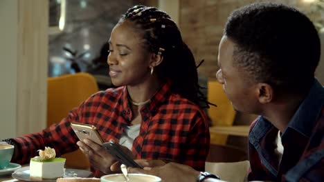 Attractive-young-black-couple-in-a-cafeteria