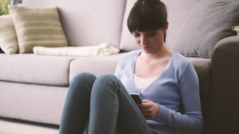 Girl-texting-with-her-mobile