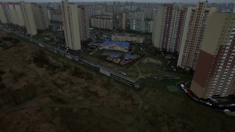 Aerial-drone-footage-of-gray-urban-city-outskirts-with-identical-houses