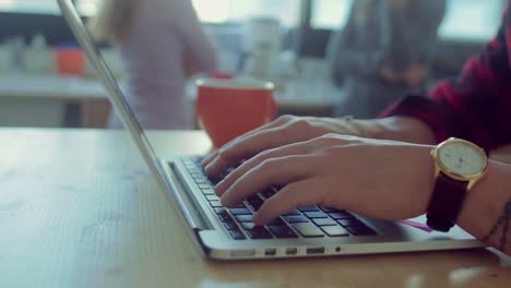 Close-up-shot-of-man-working-in-the-startup-office