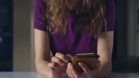 Woman-using-smartphone-at-home-in-the-city