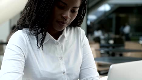 Attractive-African-American-woman-working-with-laptop.