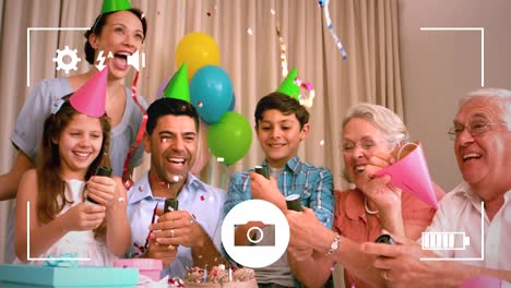 Taking-photos-of-family-at-birthday-party-on-a-digital-camera