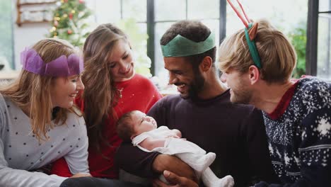 Gay-Male-Couple-With-Adopted-Baby-Daughter-Celebrating-First-Christmas-With-Friends