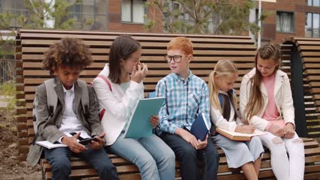 Group-of-Pupils-Sitting-on-Bench