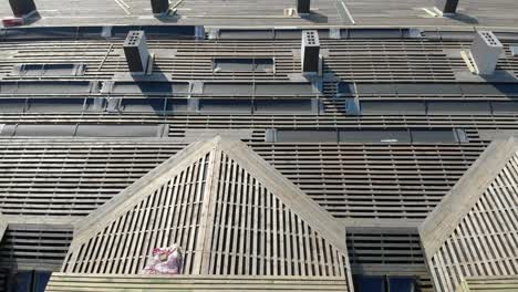 Aerial-flying-over-the-wooden-roof-of-an-unfinished-house.-Construction