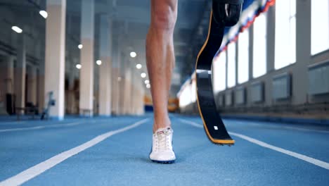 Close-up-of-a-male-artificial-leg-being-warmed-up-before-jogging