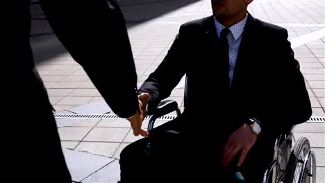 Happy-Entrepreneur-Shaking-Hands-With-Colleague-Businessman-Outdoor