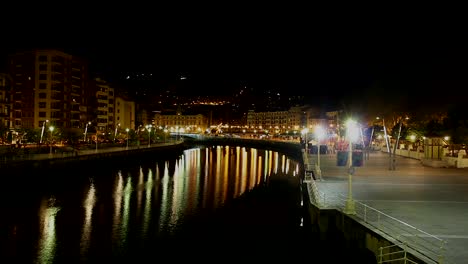 Magic-view-to-night-reflection-of-modern-Spanish-buildings-in-Nervion-river