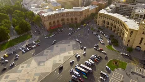 Automobiles-driving-on-Republic-square-in-Yerevan,-aerial-view-of-main-street