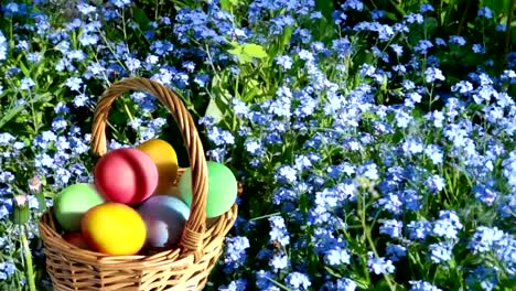 A-congratulatory-text-on-the-Easter-holiday-and-a-basket-with-colored-eggs