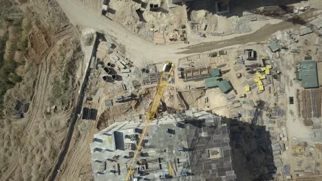 Aerial-view.-Construction-of-a-modern-district-with-residential-apartments-and-developed-infrastructure.-A-construction-site-with-cranes-and-tall-buildings.-Sale-and-rental-of-real-estate