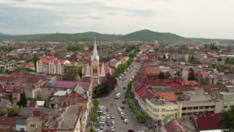 Aerial-view-Peace-Square-of-Mukachevo.-Nearby-is-the-Gothic-chapel-of-St.-Joseph,-city-hall-і-Cathedral-Church-of-St.-Martine.-Eastern-Carpathian-mountains.-Ukraine