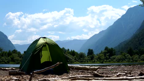 A-tourist-tent-stands-on-the-shore-of-the-lake.