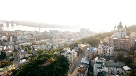 KIev-Ukraine-aeriel-drone-view-to-Andriyivskyy-Descent,-Podil,-St.Andrew's-Church,-river-Dnepr.