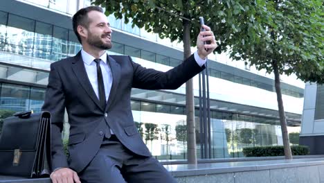 Businessman-Taking-Selfie-on-Phone