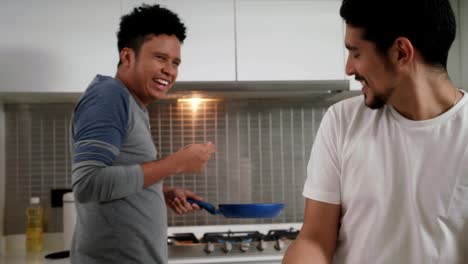 Gay-People-Having-Breakfast-Cooking-In-Home-Kitchen