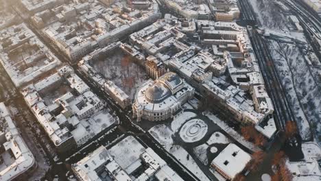 Cinematic-aerial-footage-of-old-city-center-and-opera-and-ballet-theatre-during-sunny-winter-day