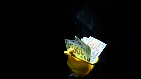 yellow-purse-money-dollar-smoke-nobody-dark-background-hd-footage