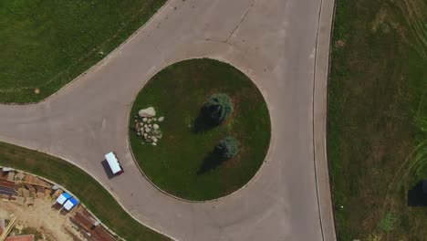 Bride-and-groom-ride-a-carriage-in-the-Park-on-a-summer-day,-aerial-shot