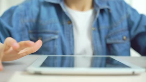 closeup-of-kid-fingers-touching-screen-of-tablet-while-playing-games-online