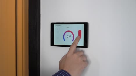 Smart-home-climate-control-device-on-a-wall